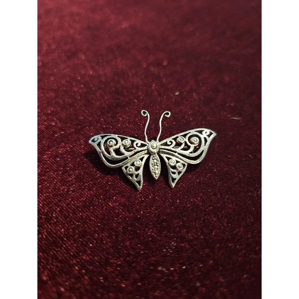 sterling butterfly pin. Marked 925 and hallmark CFT. About 1.5‎ brouch